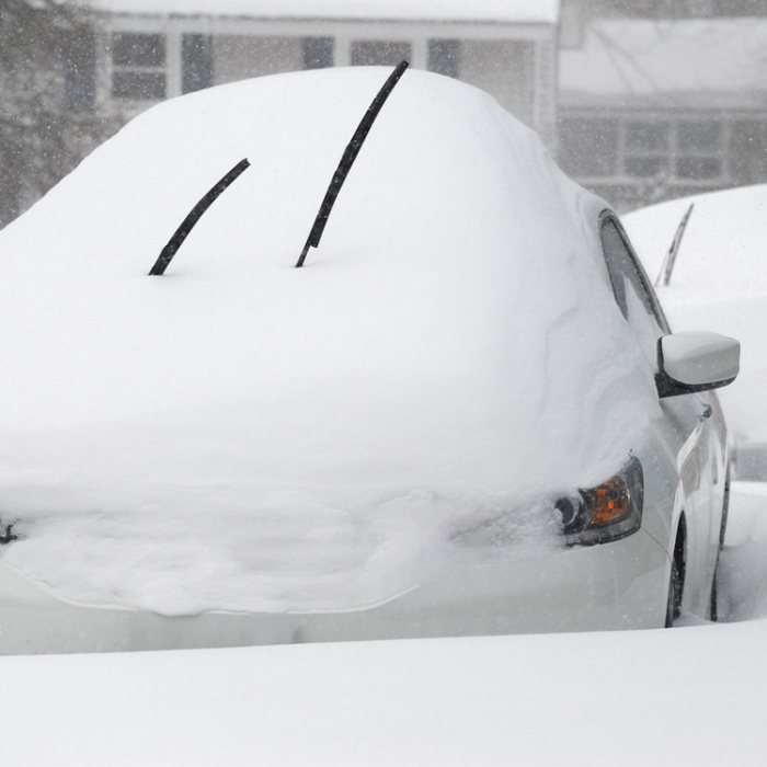 Cars buried under snow