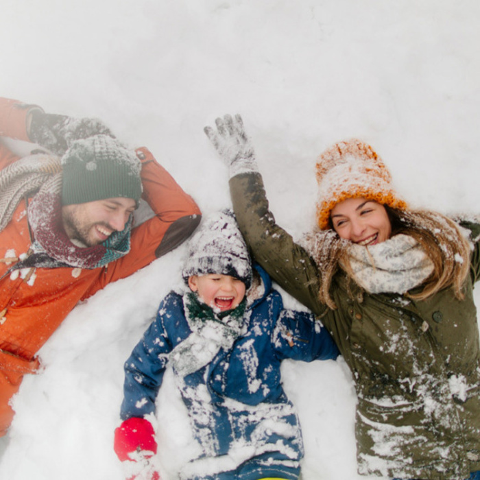 Family playing in the snow